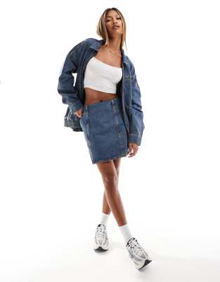 denim mini skirt in mid blue wash