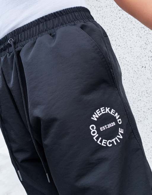 ASOS Weekend Collective nylon sweatpants with logo in black ASOS