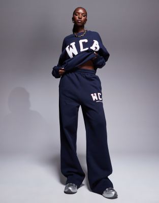 ASOS - Weekend Collective - Oversize-Jogginghose in Marineblau mit College-Logo, Kombiteil