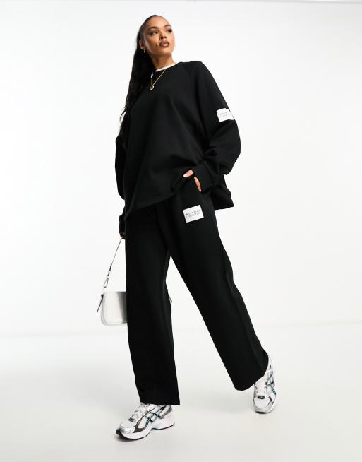 ASOS Weekend Collective oversized sweatshirt with woven logo in black