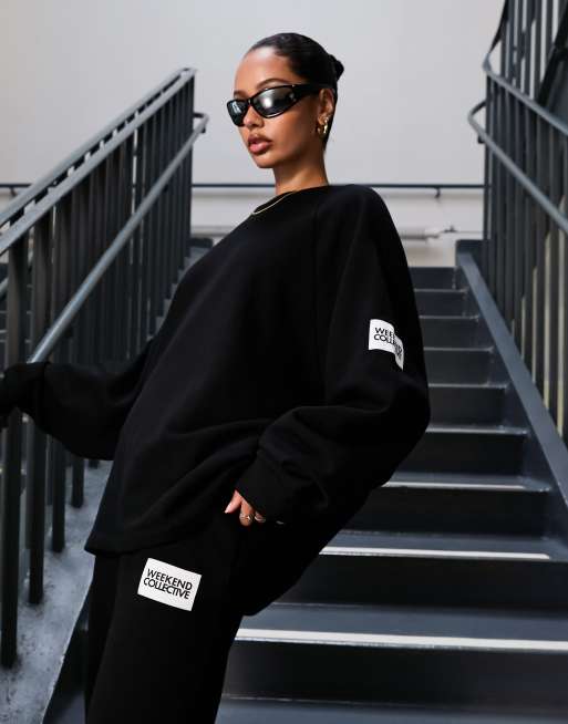 ASOS Weekend Collective oversized sweatshirt with woven logo in black