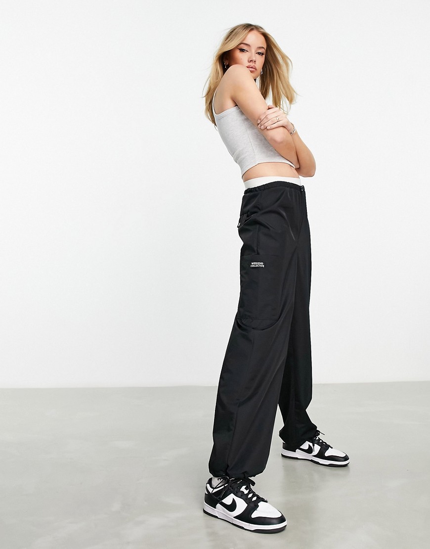 ASOS Weekend Collective parachute cargo pants with pocket in black