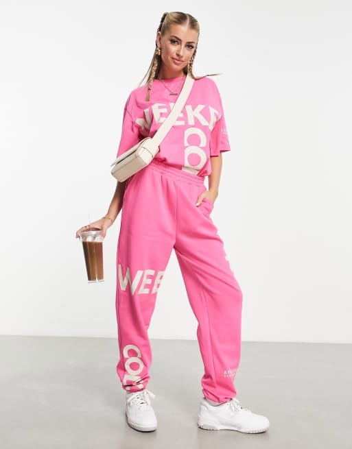 ASOS Weekend Collective trackies with cut about graphic in pink