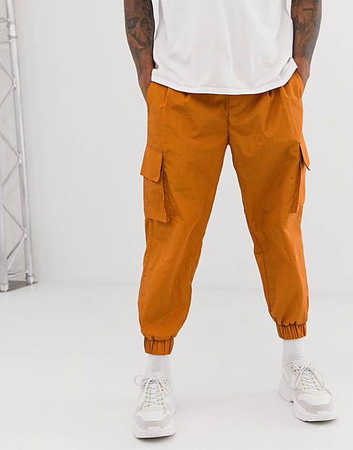 ASOS WHITE tapered joggers in rust nylon with cargo pockets | ASOS