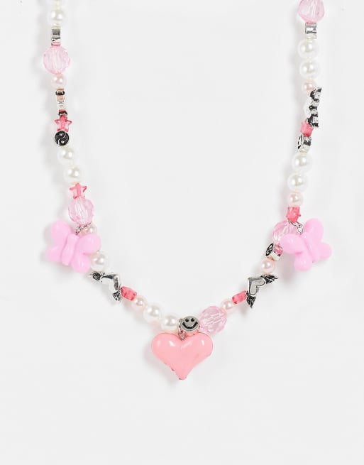 ASOS DESIGN - Collier de perles fantaisie avec pendentifs papillons et cœurs en 3D