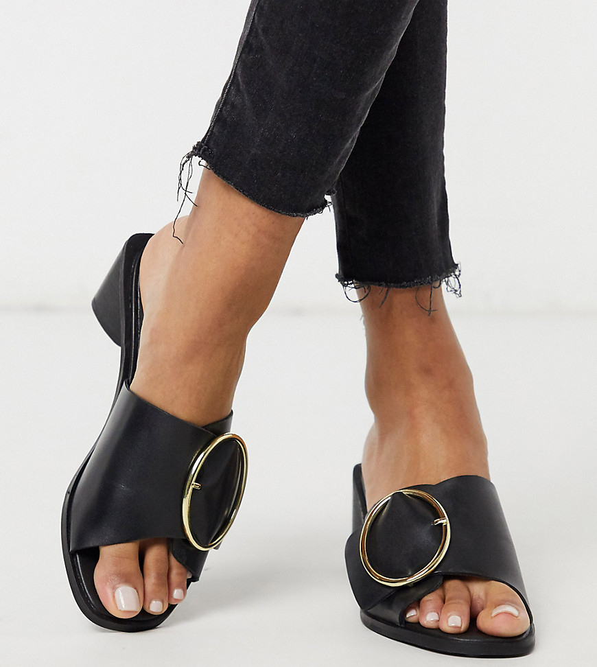 ASRA Exclusive Justice mules with statement buckle in black leather