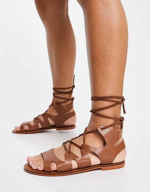 ASRA Savannah flat sandals with ankle tie in tan