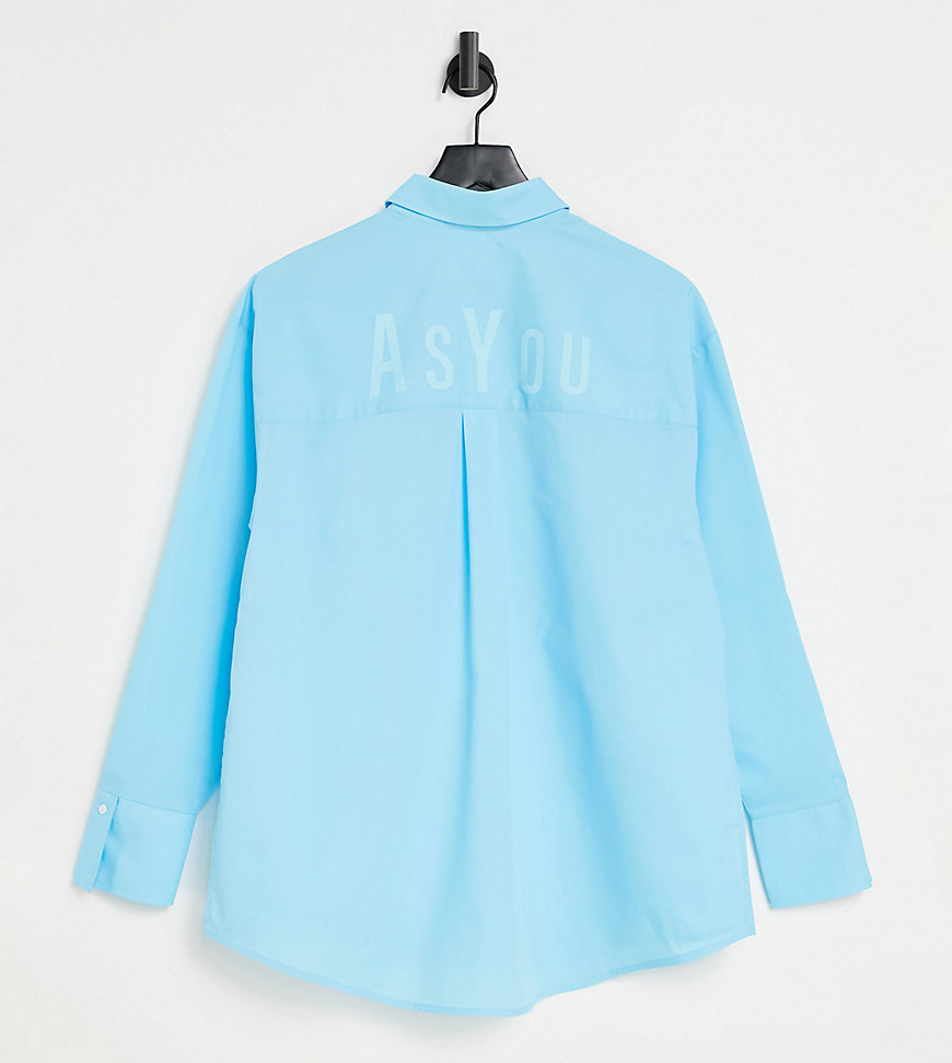 ASYOU – Aquablå skjorta i oversize med logga baktill