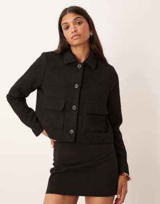 AWARE - Bouclé-Jacke in Schwarz mit Knopfleiste
