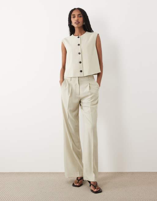 AWARE - Coordinato color crema con pantaloni bootcut e gilet sartoriale taglio corto