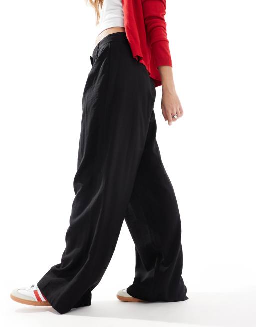 AWARE – Czarne eleganckie spodnie o fasonie dad z drapowaniem, 4 z 5