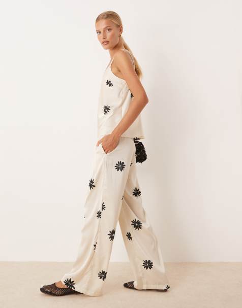 AWARE - Pantalon ample d'ensemble en satin à fleurs - Blanc et noir - view 1