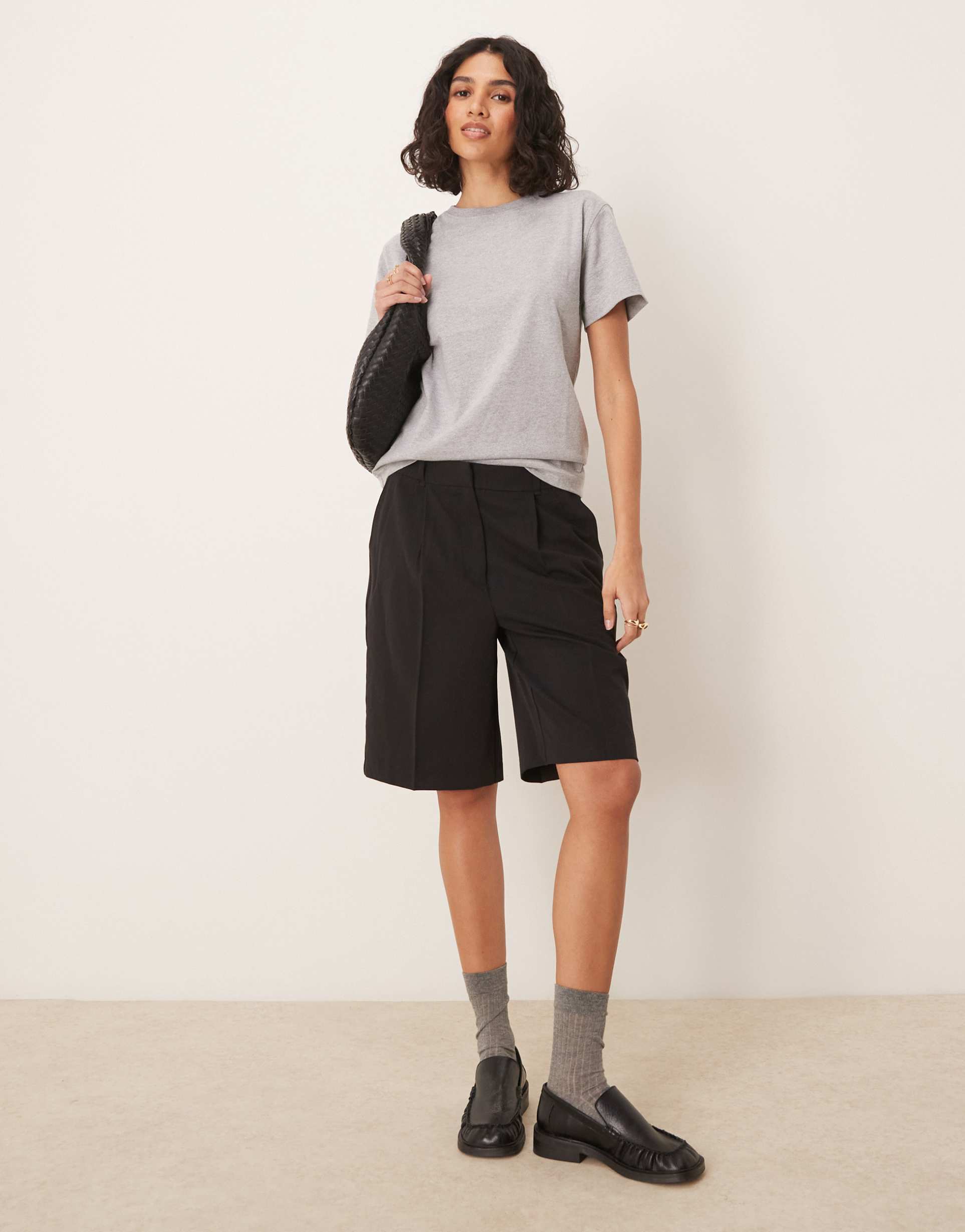 aware pleat front tailored shorts in black