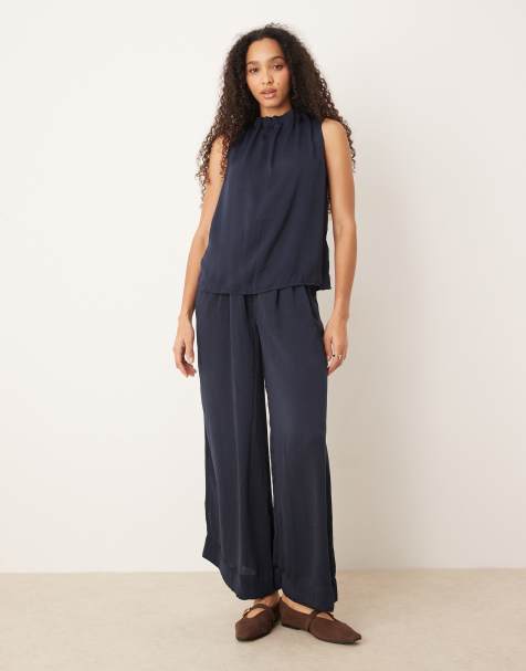 AWARE pleated high neck detail sleeveless top and pleated wide leg trouser set in in navy - view 1