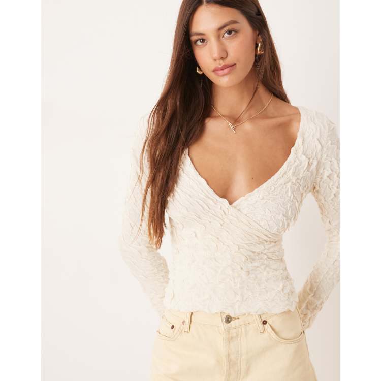 AWARE stretchy jacquard knit bell sleeve wrap detail top in