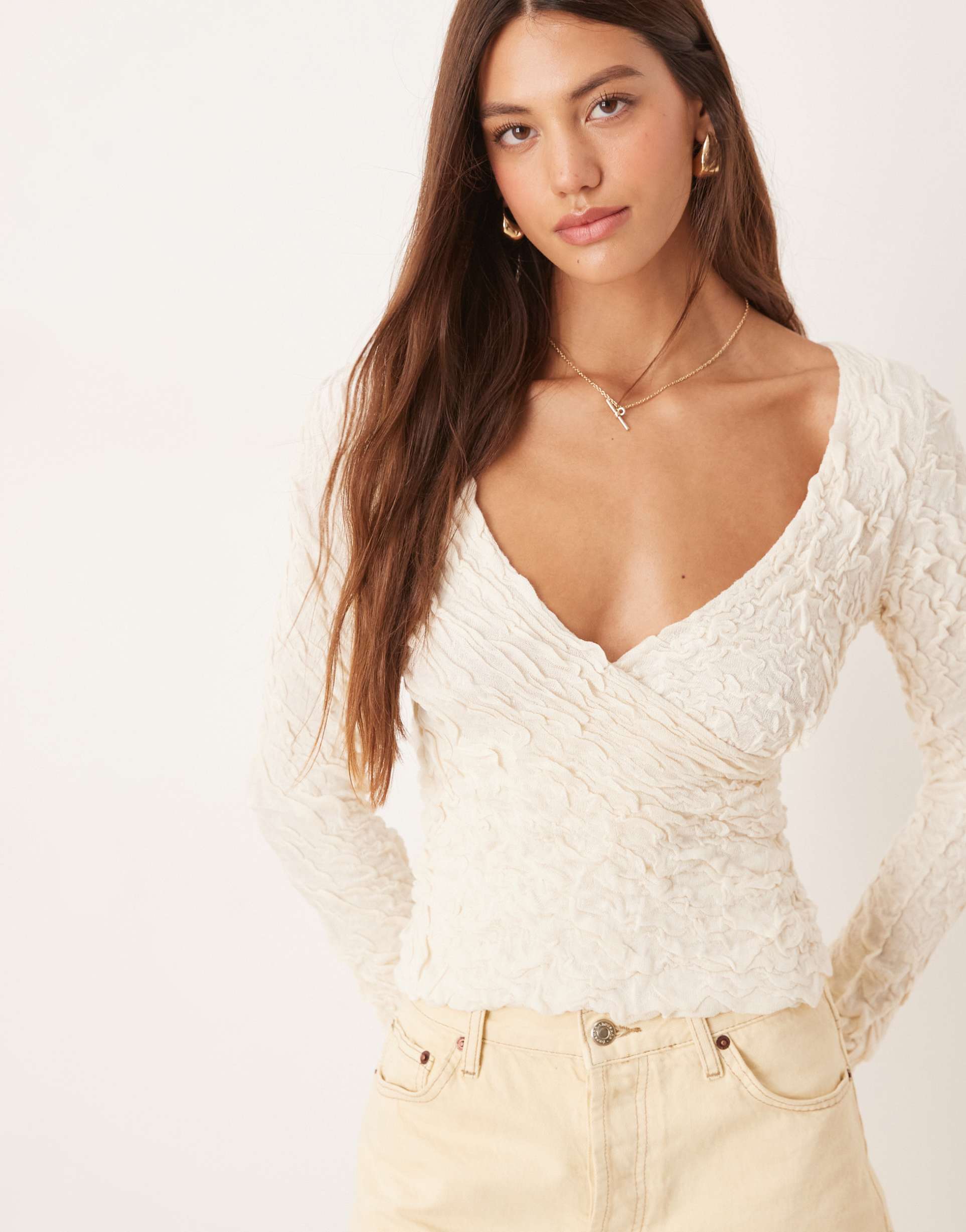 aware stretchy jacquard knit bell sleeve wrap detail top in cream