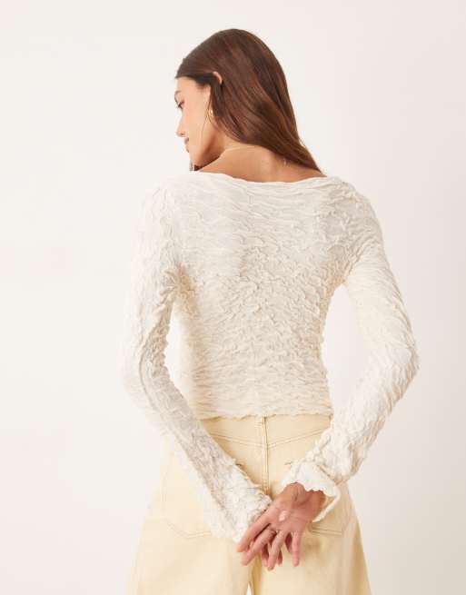 AWARE stretchy jacquard knit bell sleeve wrap detail top in cream 