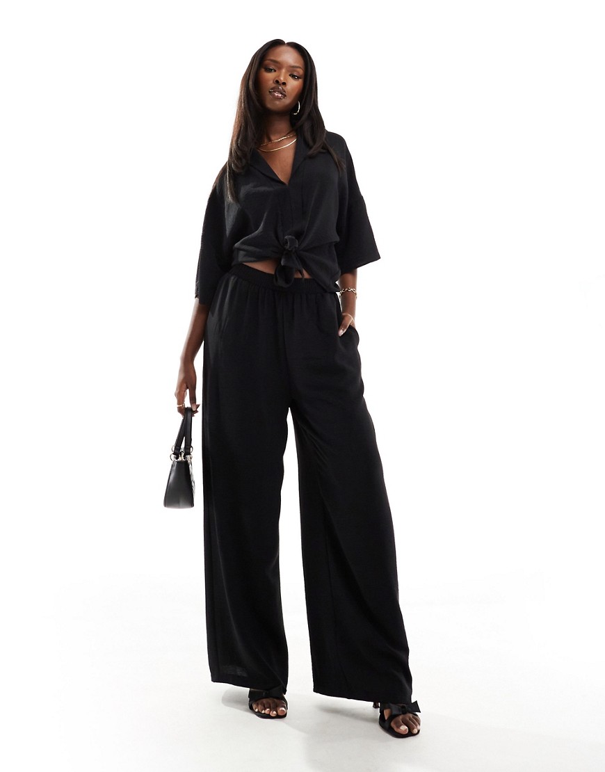 textured wide leg pants in black - part of a set