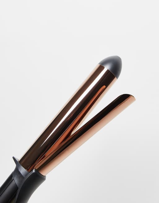 Plugged in outlet spring curling iron