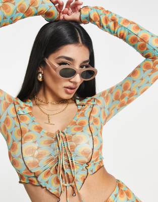 Bailey Rose ruched front top with asymmetric hem in 70s print mesh co-ord - ASOS Price Checker