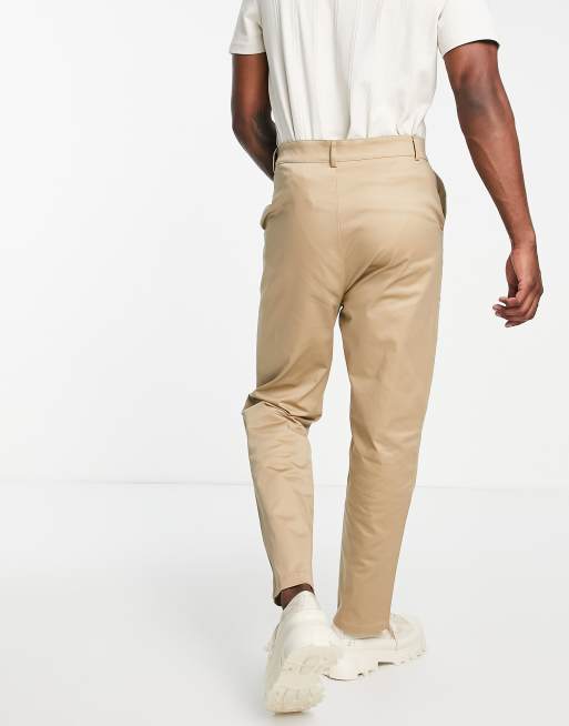 Beige carrot pants with pockets and belt