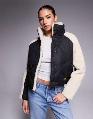 Barbour International - Oversize-Steppjacke in Schwarz und Beige mit Fleece-Ärmeln