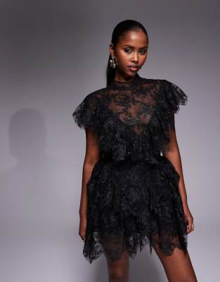 Bardot - Tarryn - Hochgeschlossenes Minikleid aus Spitze in Schwarz mit Rüschen und Muschelsaum