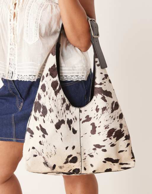 Barneys Originals Real leather cow print shoulder bag in black / white