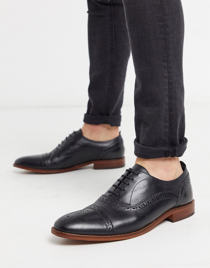 Base london cast brogues in black leather