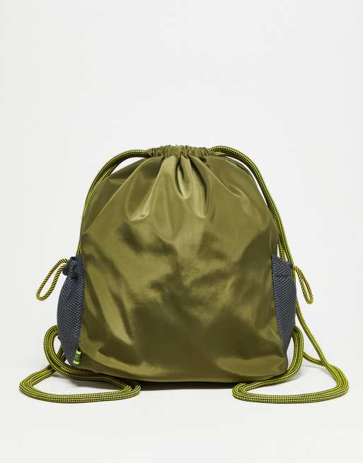 Basic Pleasure Mode drawstring backpack in khaki with black mesh side  pockets