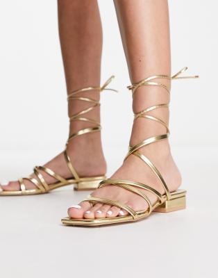 vinny strappy tie leg flat sandals in gold