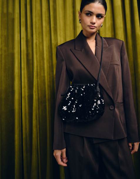 Becksondergaard Bonita sequin pillow clutch bag with crossbody strap in black - view 1