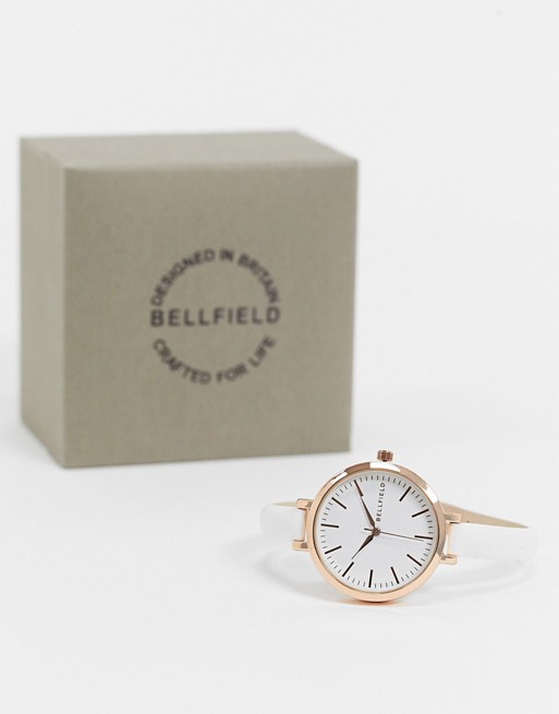 Bellfield watch with skinny white stap and rose goal dial