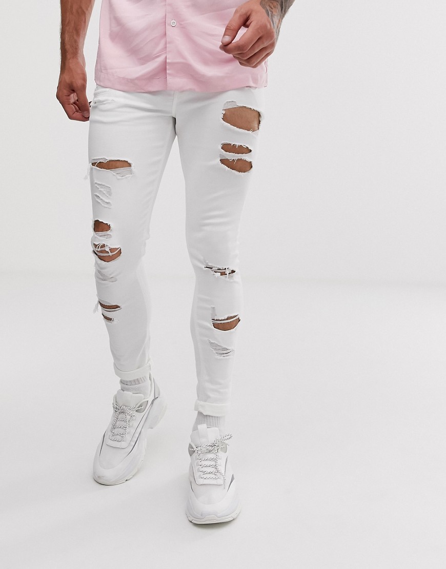 фото Белые эластичные джинсы с напылением и рваной отделкой asos design-белый