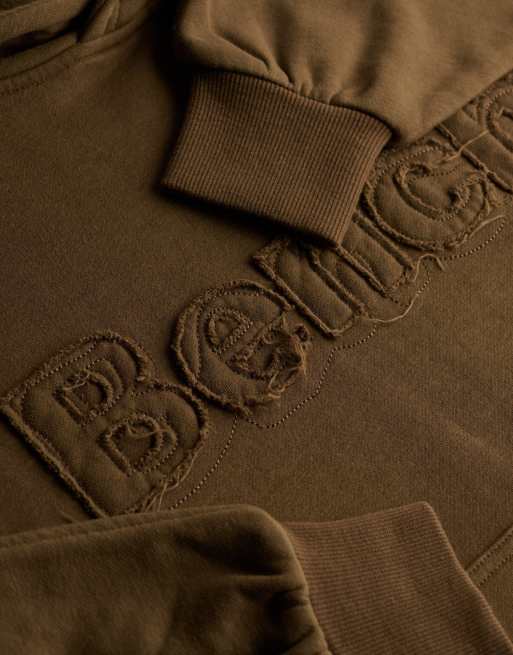Bench. x Superdry & Co – Oversize-Kapuzenpullover in Chocolate Chip mit Applikation, 2 von 5