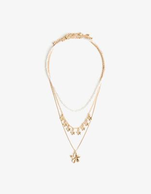 Bershka - 3er-Pack Halsketten in Goldoptik mit Blumenanhängern und Kunstperlen-Goldfarben