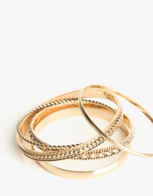 Bershka - 5-Pack Armreifen in Metallic-Goldoptik-Goldfarben