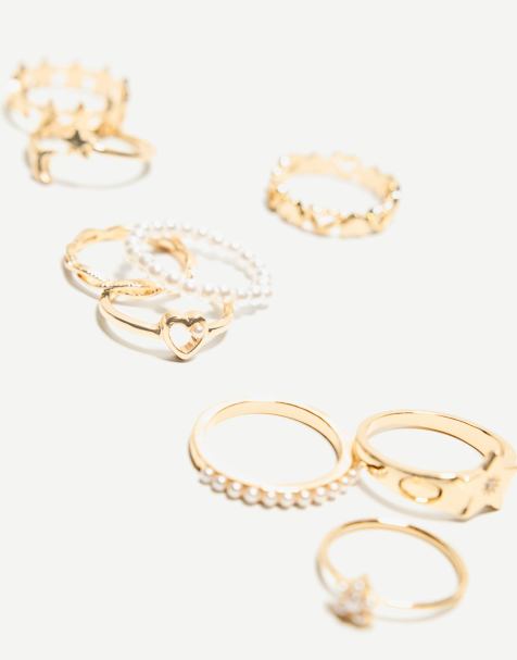 Bershka 9 pack of thin faux pearl rings in gold - view 1