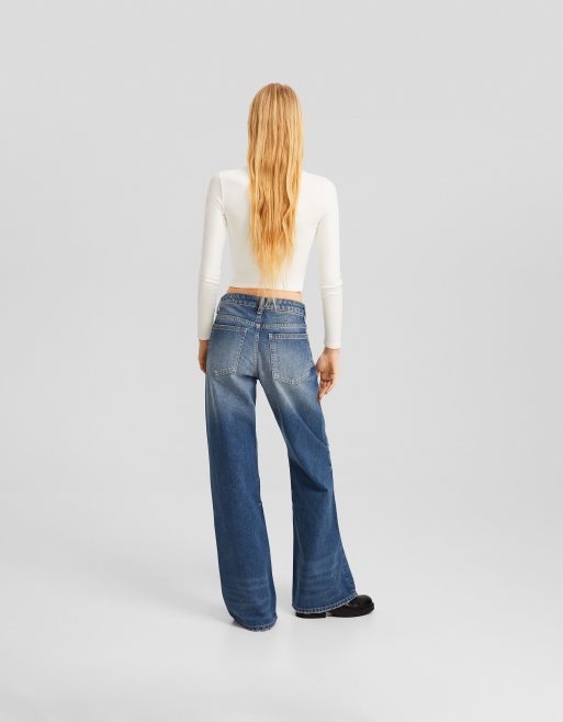 Bershka low waist bootcut jeans in dirty wash blue