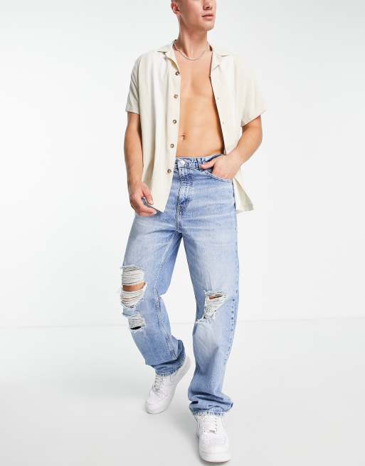 Bershka - Baggy jeans met scheuren in blauw
