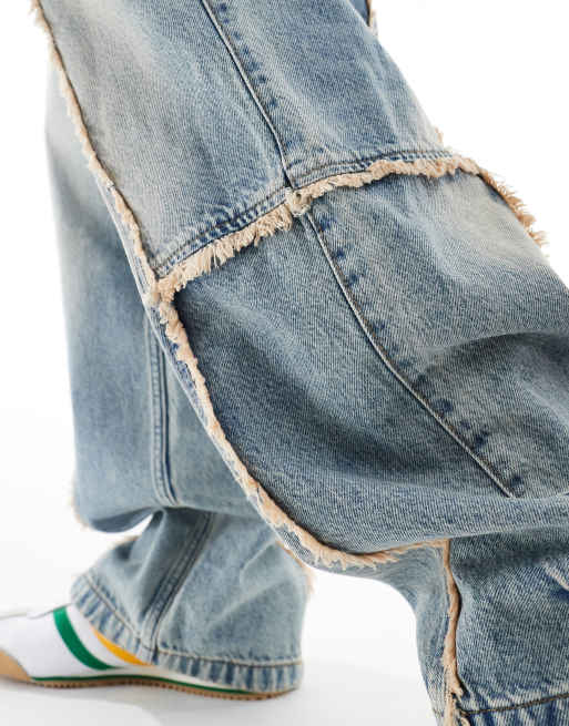 Bershka baggy jeans with frayed seams in blue | ASOS