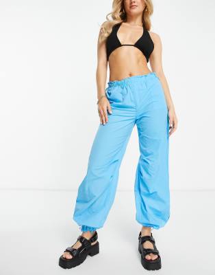 Bershka baggy parachute tech pant in blue