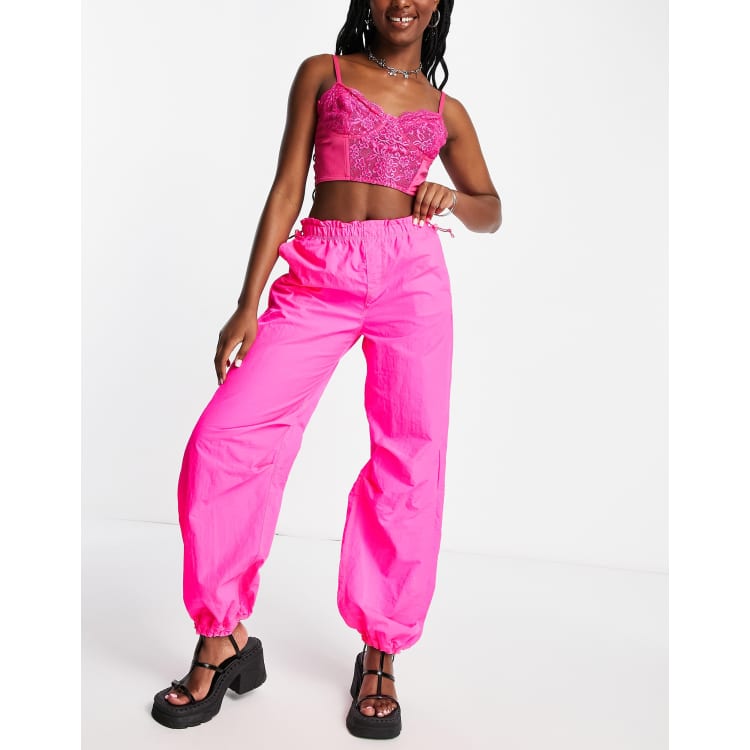 Bershka baggy parachute tech pants in pink