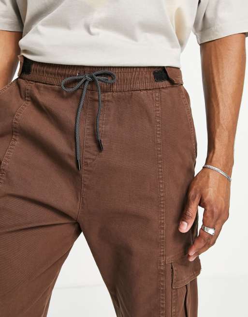 Bershka cuffed cargo pants in brown exclusive at ASOS