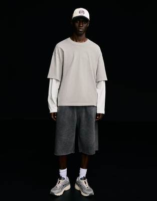Bershka - Bermuda en jersey à bords bruts - Noir