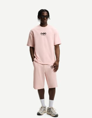 Bershka - Bermuda imprimé en tissu molletonné - Rose