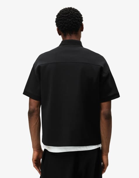 Bershka Boxy short-sleeve polo shirt in black