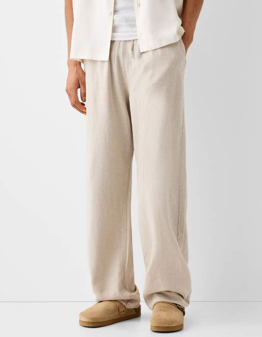 Bershka - Broek van linnen met wijde pijpen in zandkleur