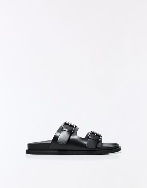 Bershka Buckled flat slider sandals in black - view 1