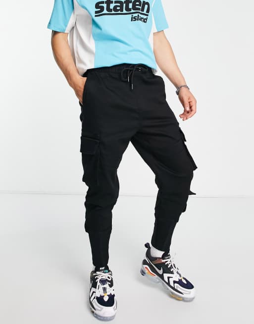 Bershka cargo pants with pockets in black ASOS